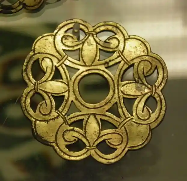 Set of gilt-bronze ornaments, solar cross, sun disc